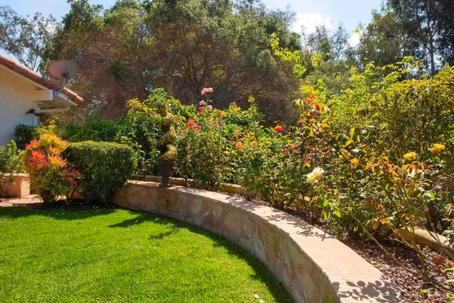 an outdoor space with furniture and umbrella