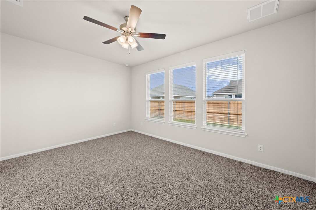 8024 Pineridge Way Temple, TX 76502 - Photo 25 of 32 wooden floor in an empty room with a window
