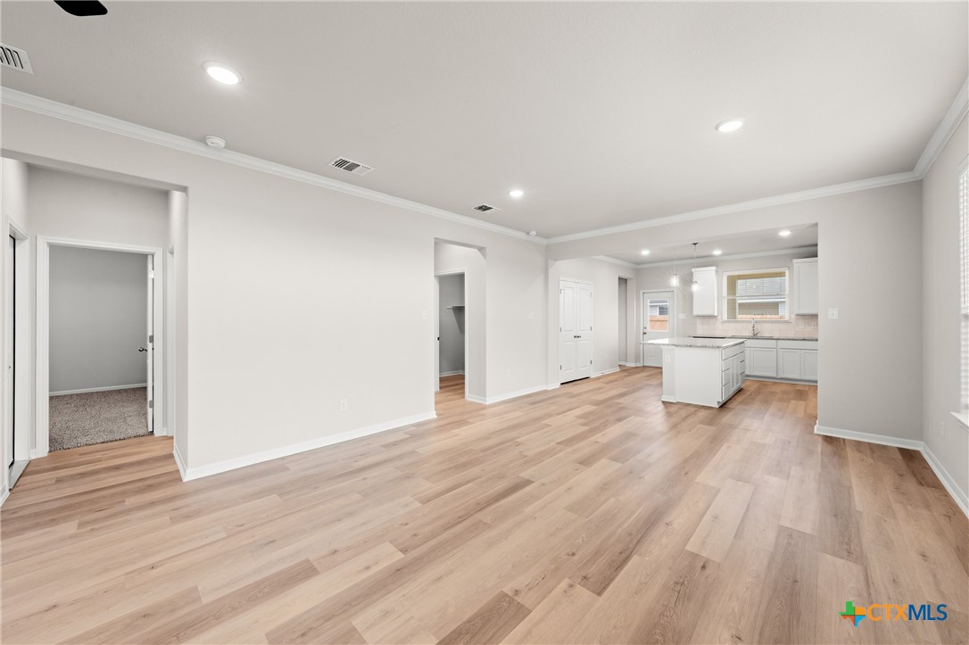 8024 Pineridge Way Temple, TX 76502 - Photo 8 of 32 a view of a kitchen with wooden floor and a kitchen