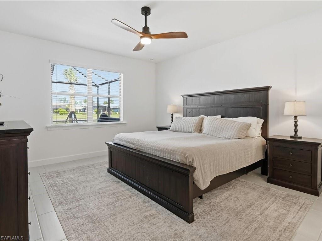 1937 Don Benito Way Naples, FL 34120 - Photo 12 of 27 Bedroom with a ceiling fan and baseboards
