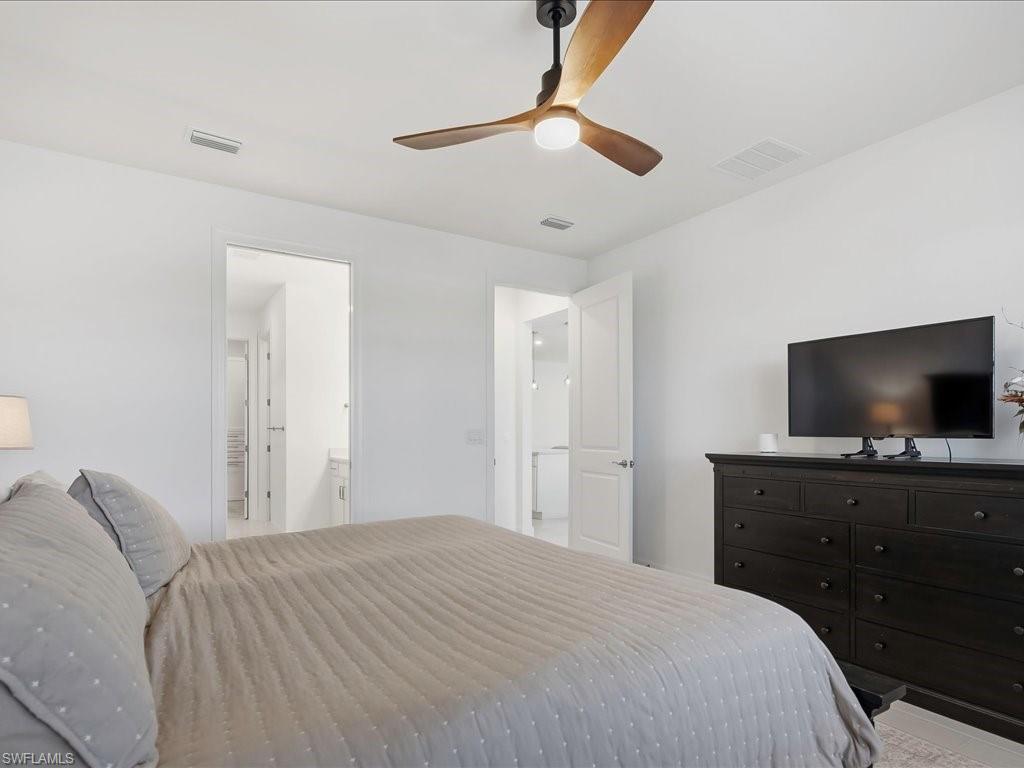 1937 Don Benito Way Naples, FL 34120 - Photo 13 of 27 Bedroom with ceiling fan