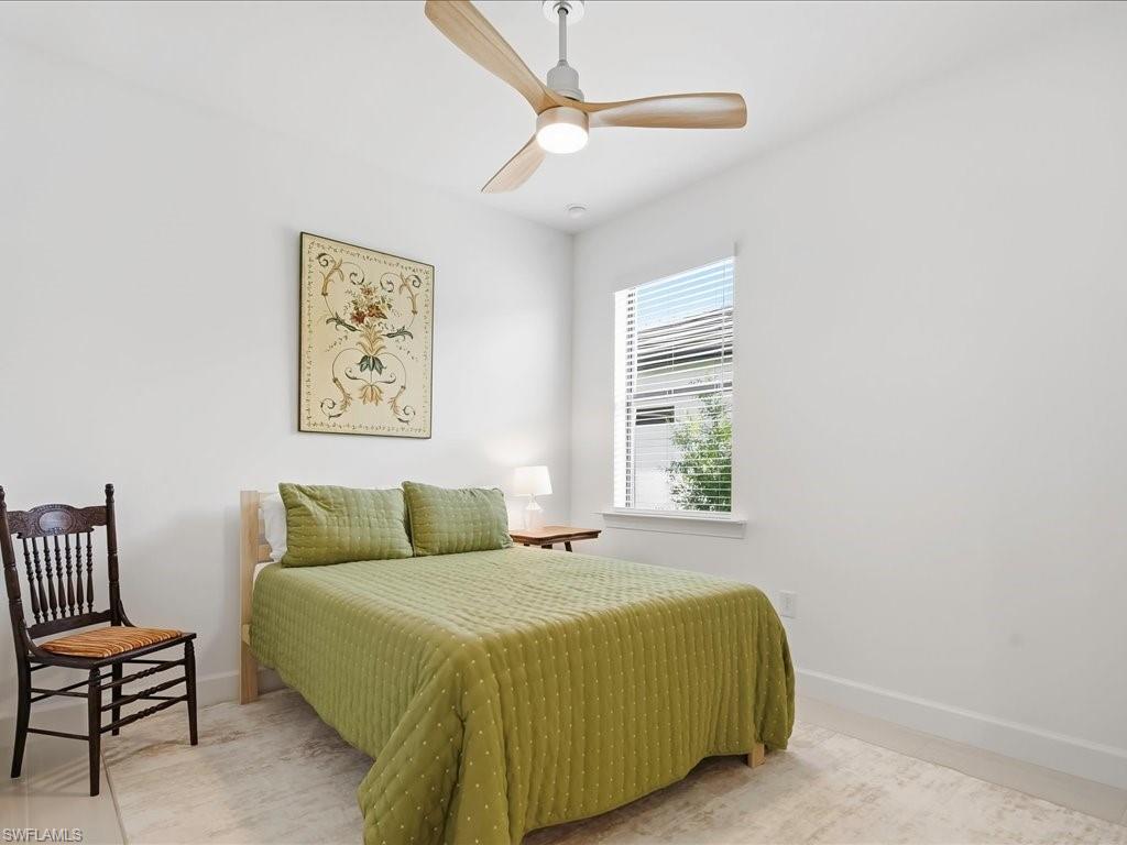 1937 Don Benito Way Naples, FL 34120 - Photo 19 of 27 Bedroom with baseboards and ceiling fan