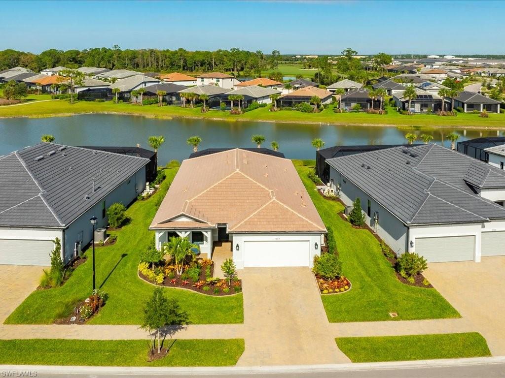 1937 Don Benito Way Naples, FL 34120 - Photo 2 of 27 Aerial view of residential area featuring a large body of water