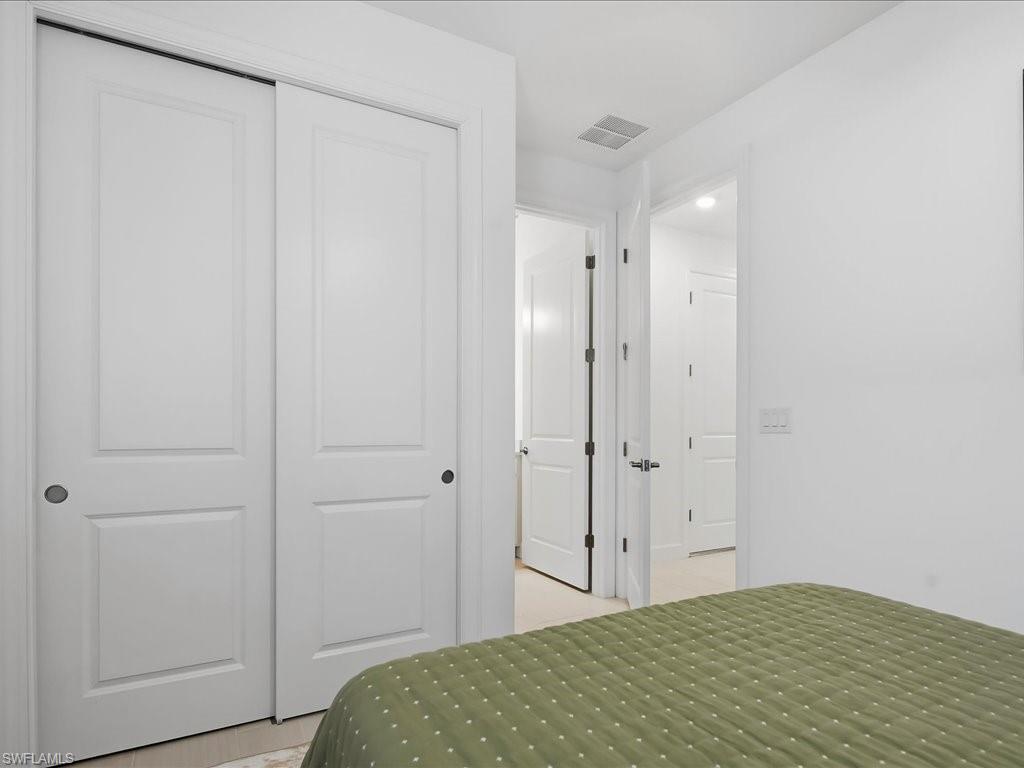 1937 Don Benito Way Naples, FL 34120 - Photo 20 of 27 Bedroom featuring a closet