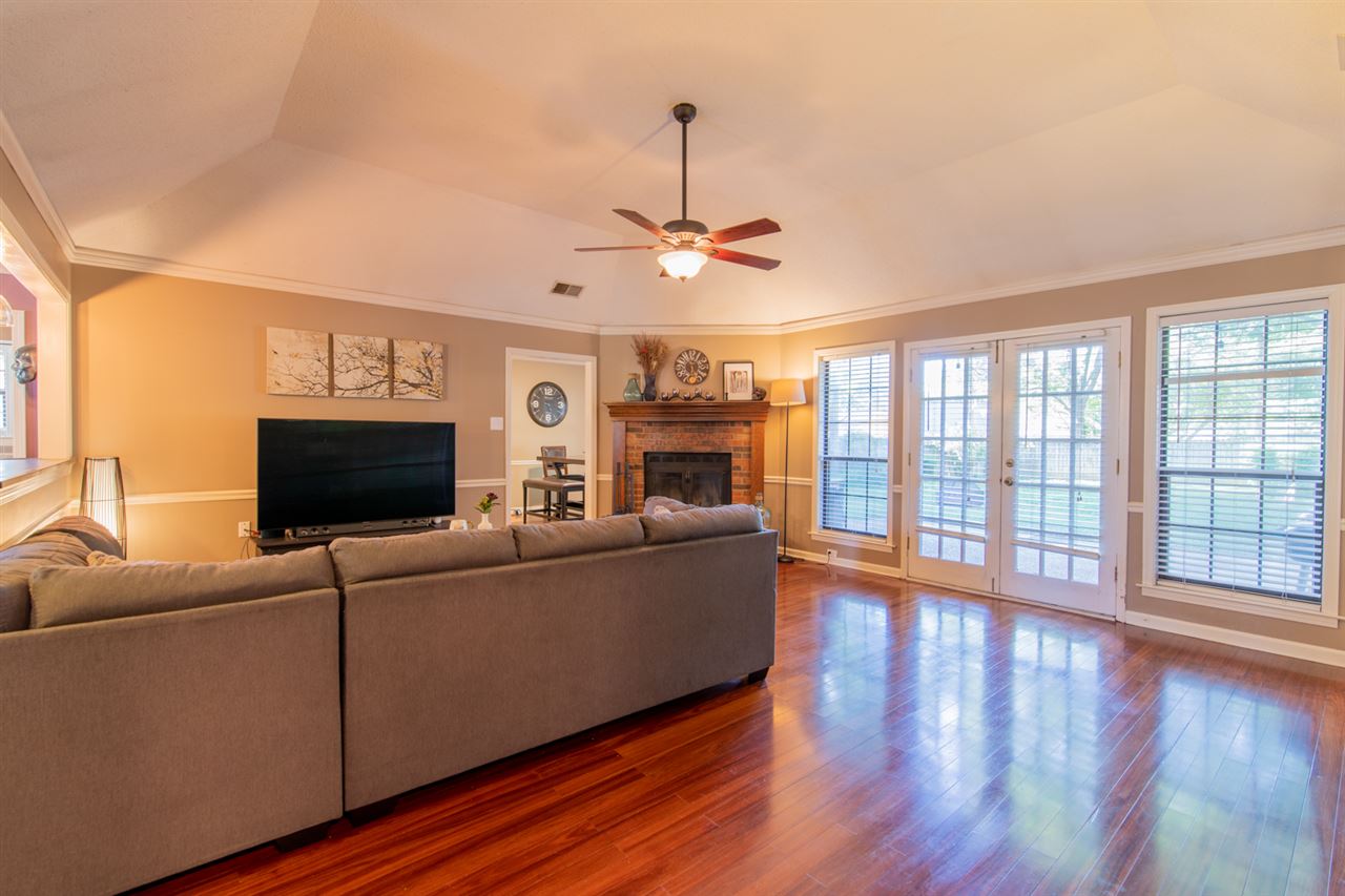 7758 Grey Squirrel Cove Memphis, TN 38018 - Photo 5 of 22 Wood floors, high ceilings and wonderful fireplace hearth.