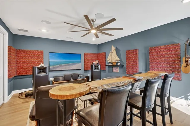 a bedroom with a bed and a chair in it