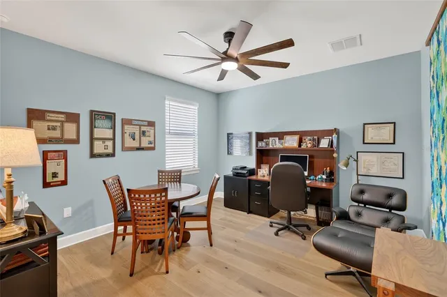 a bedroom with furniture and a baby crib