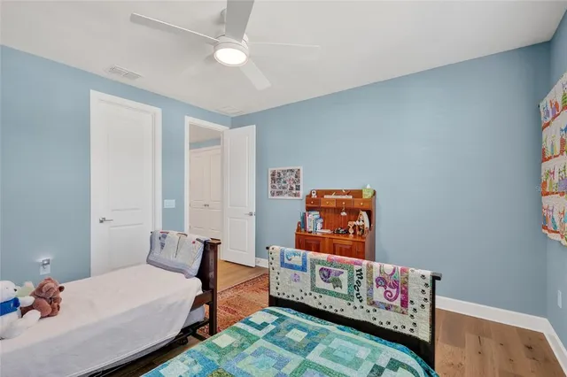 a living room with furniture and a view of kitchen