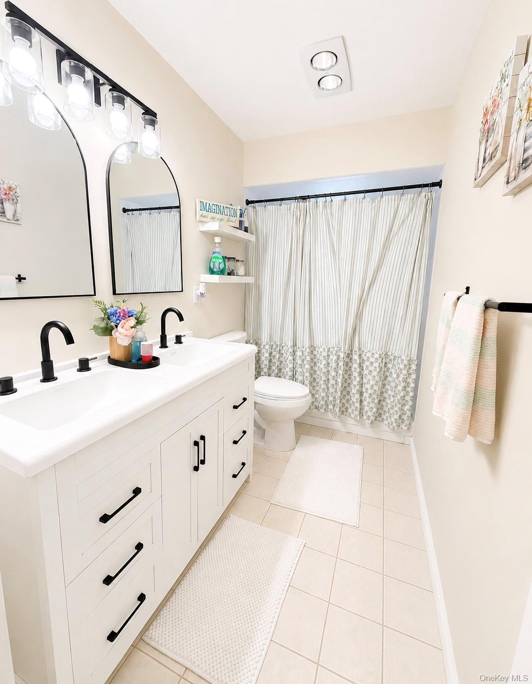 25 Rosman Road Thiells, NY 10984 - Photo 5 of 11 a bathroom with a double vanity sink and mirror