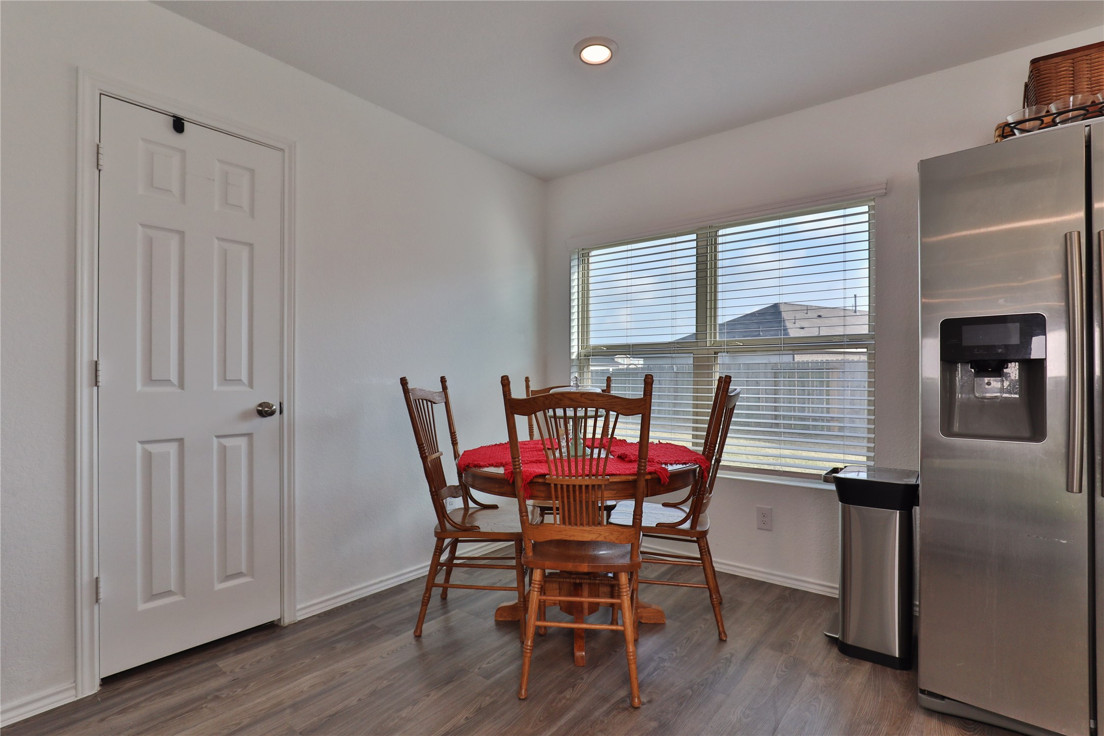 184 Kelly Street Angleton, TX 77515 - Photo 11 of 29 a view of a dining room with furniture and wooden floor