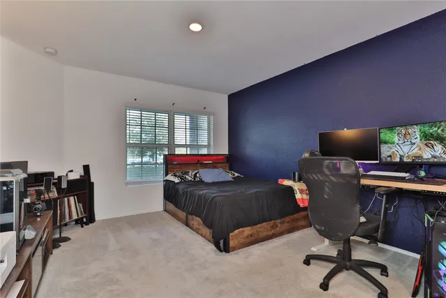 a bedroom with furniture and a window