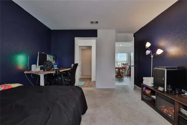 a view of a livingroom with furniture and a flat screen tv