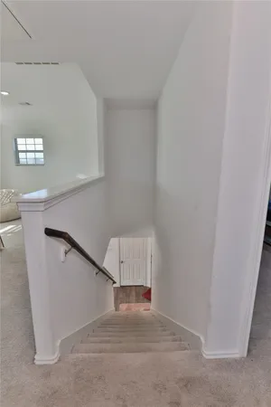 a room with a window and a fan