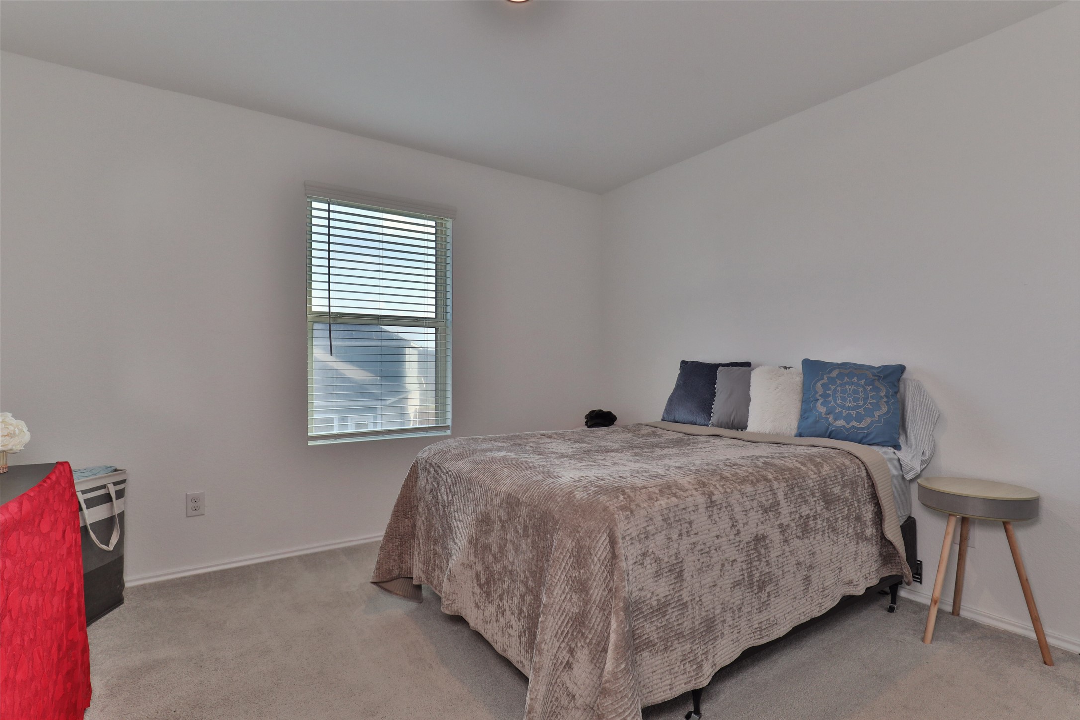 184 Kelly Street Angleton, TX 77515 - Photo 19 of 29 a bedroom with a bed and window