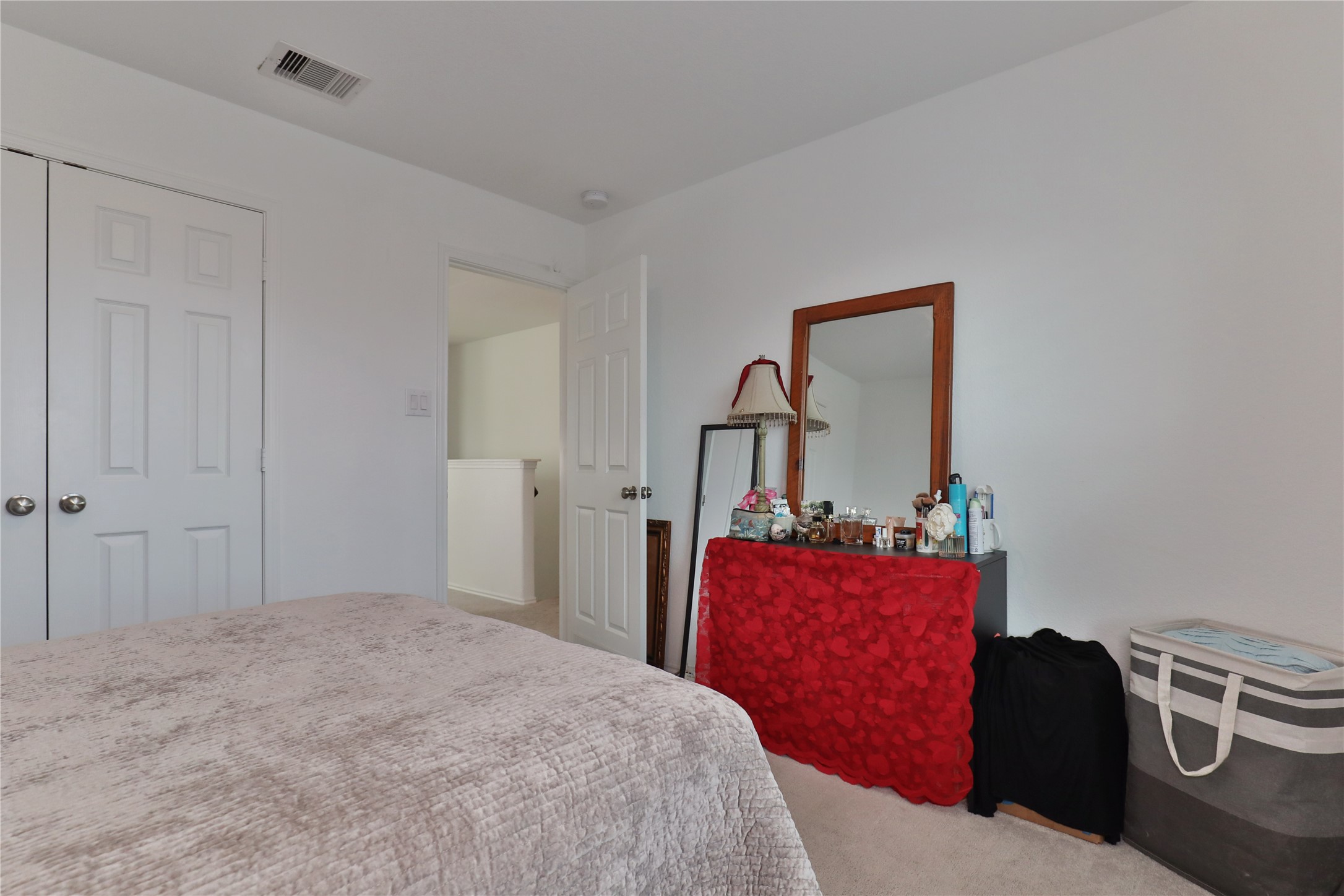 184 Kelly Street Angleton, TX 77515 - Photo 20 of 29 a bedroom with a bed and dresser