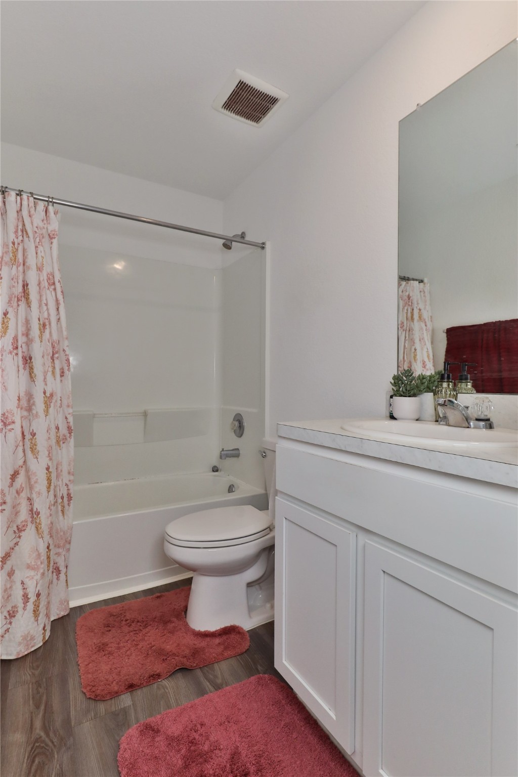 184 Kelly Street Angleton, TX 77515 - Photo 21 of 29 a bathroom with a sink a toilet and shower