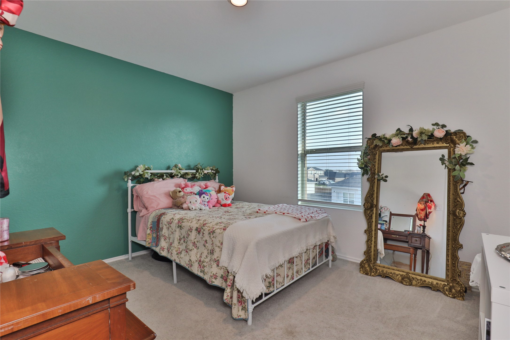 184 Kelly Street Angleton, TX 77515 - Photo 22 of 29 a bedroom with a bed and a window