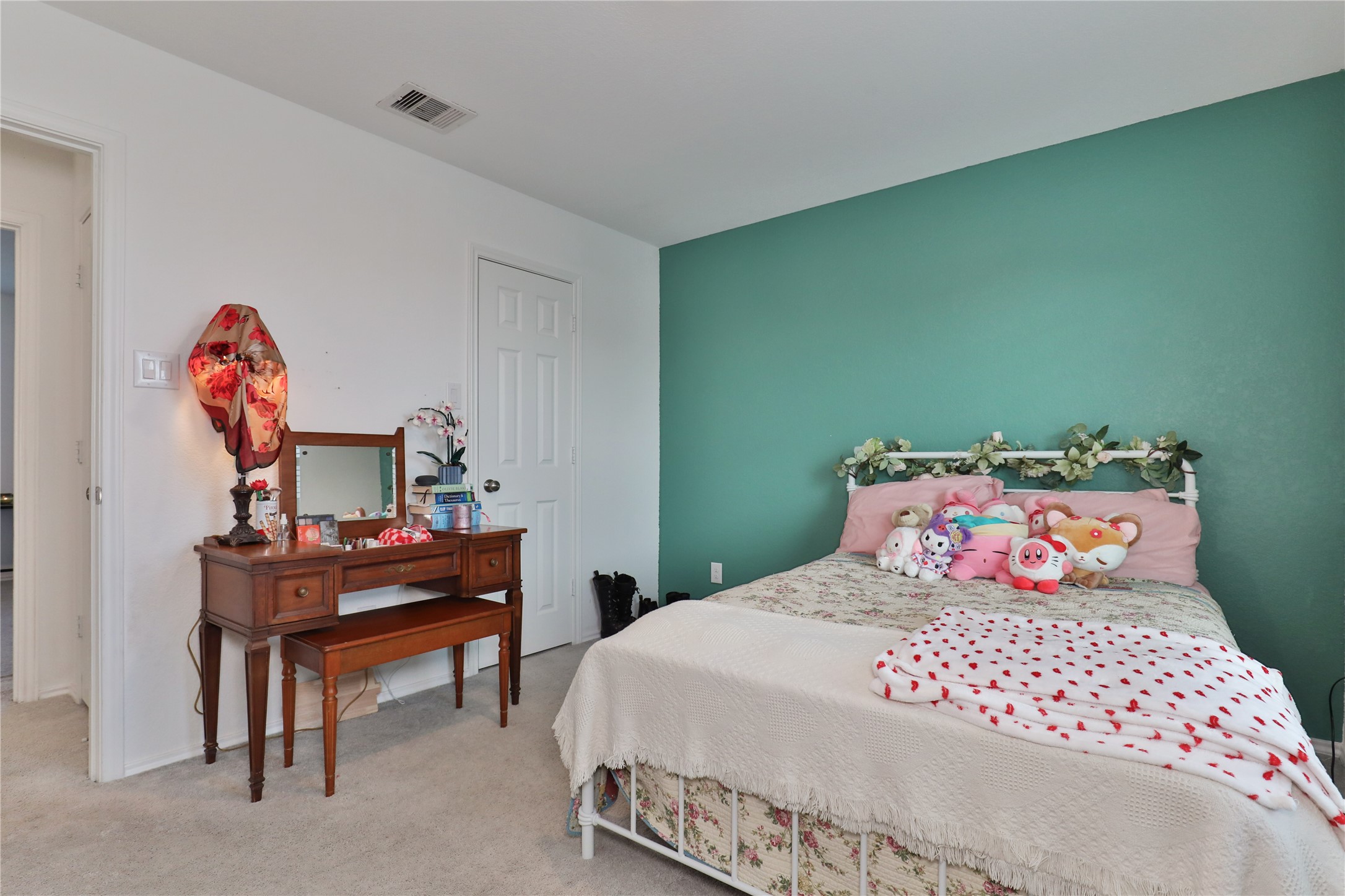 184 Kelly Street Angleton, TX 77515 - Photo 23 of 29 a bedroom with a bed and a table