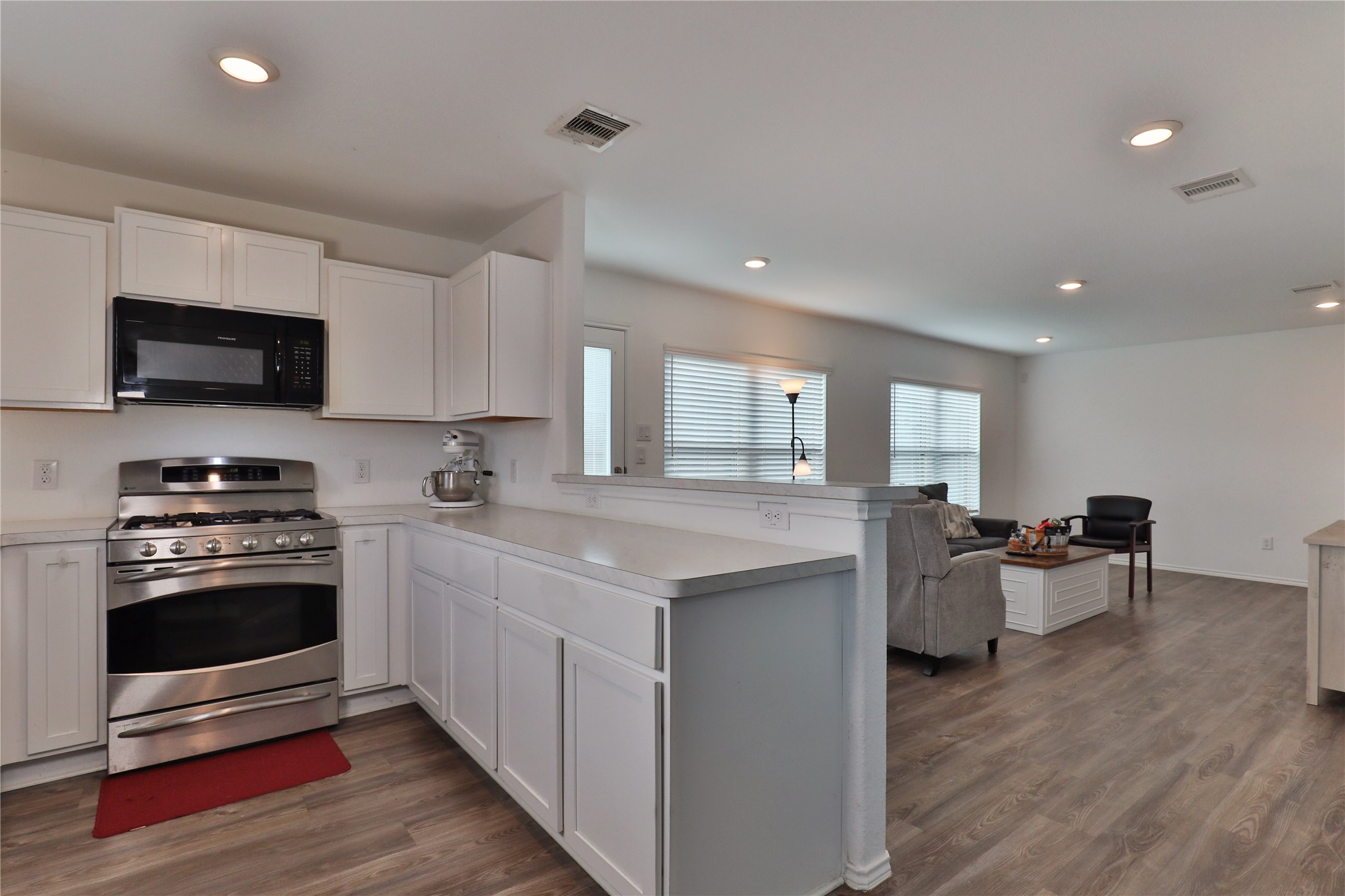 184 Kelly Street Angleton, TX 77515 - Photo 9 of 29 a kitchen with a sink and stove top oven