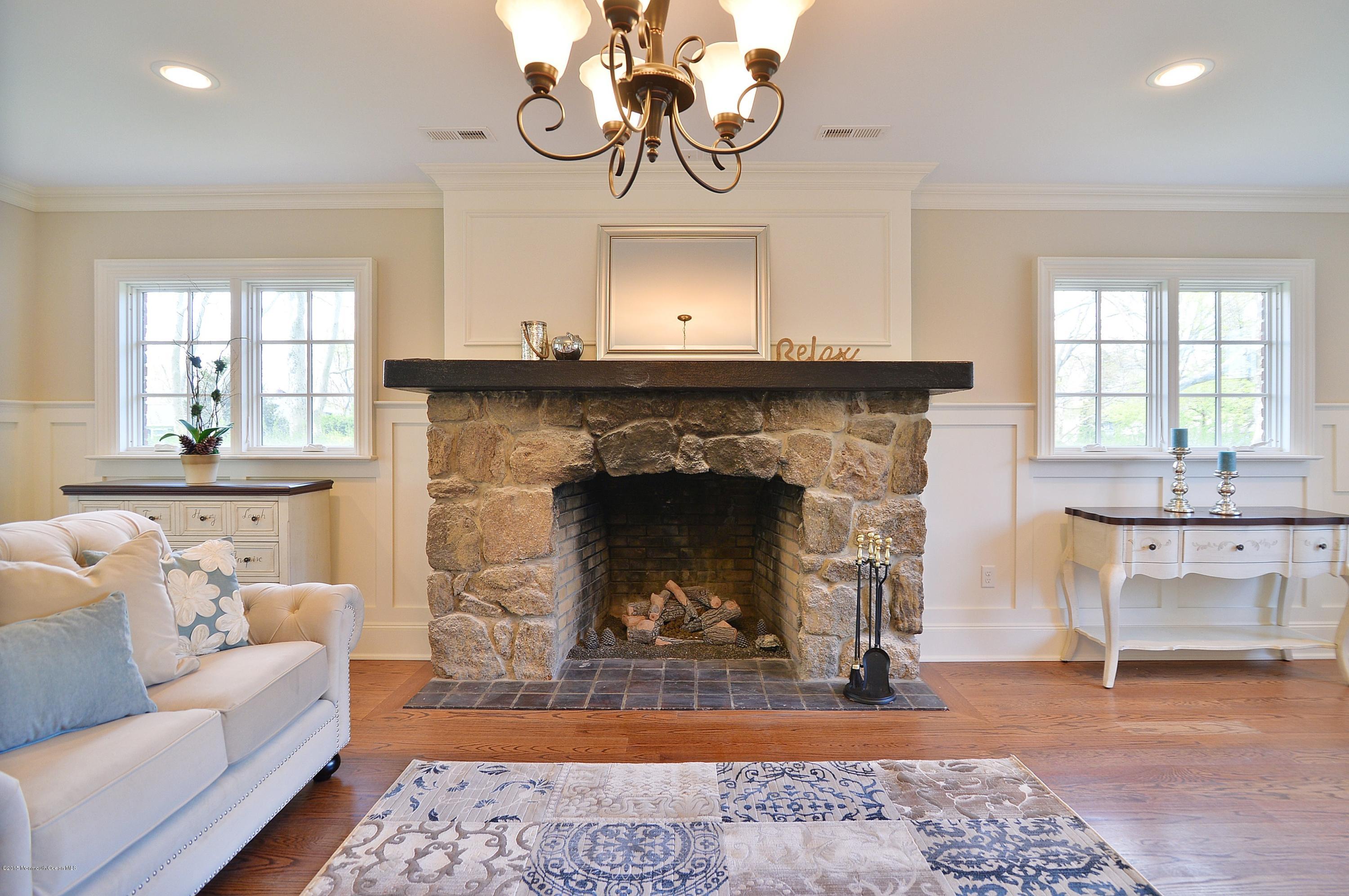 38 Silverside Avenue Little Silver, NJ 07739 - Photo 11 of 36 a living room with furniture and a fireplace