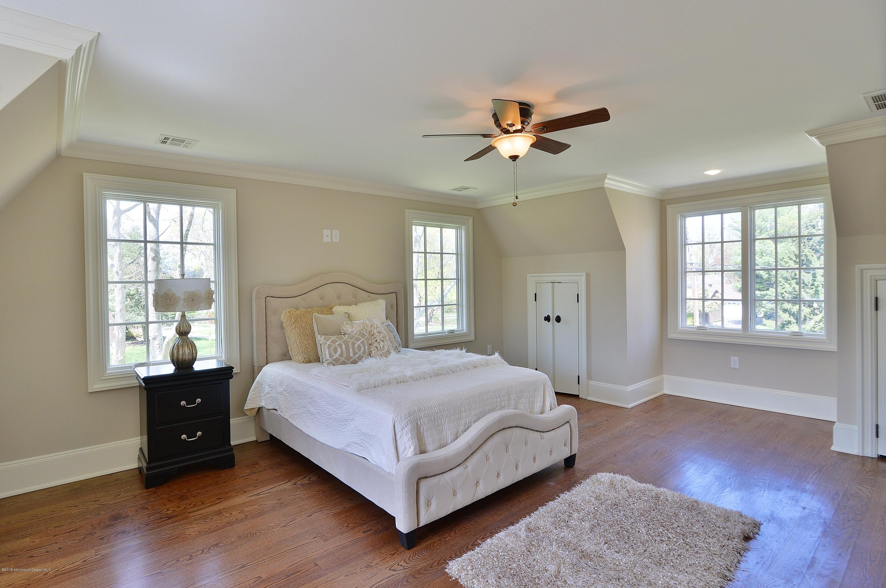 38 Silverside Avenue Little Silver, NJ 07739 - Photo 20 of 36 a bedroom with a bed and wooden floor