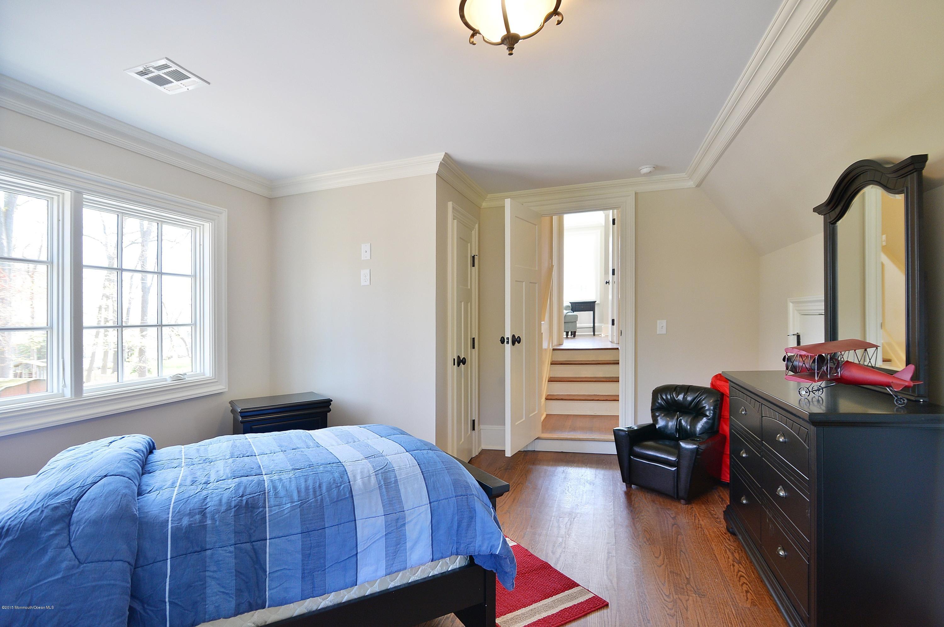 38 Silverside Avenue Little Silver, NJ 07739 - Photo 23 of 36 a bedroom with a bed and a window