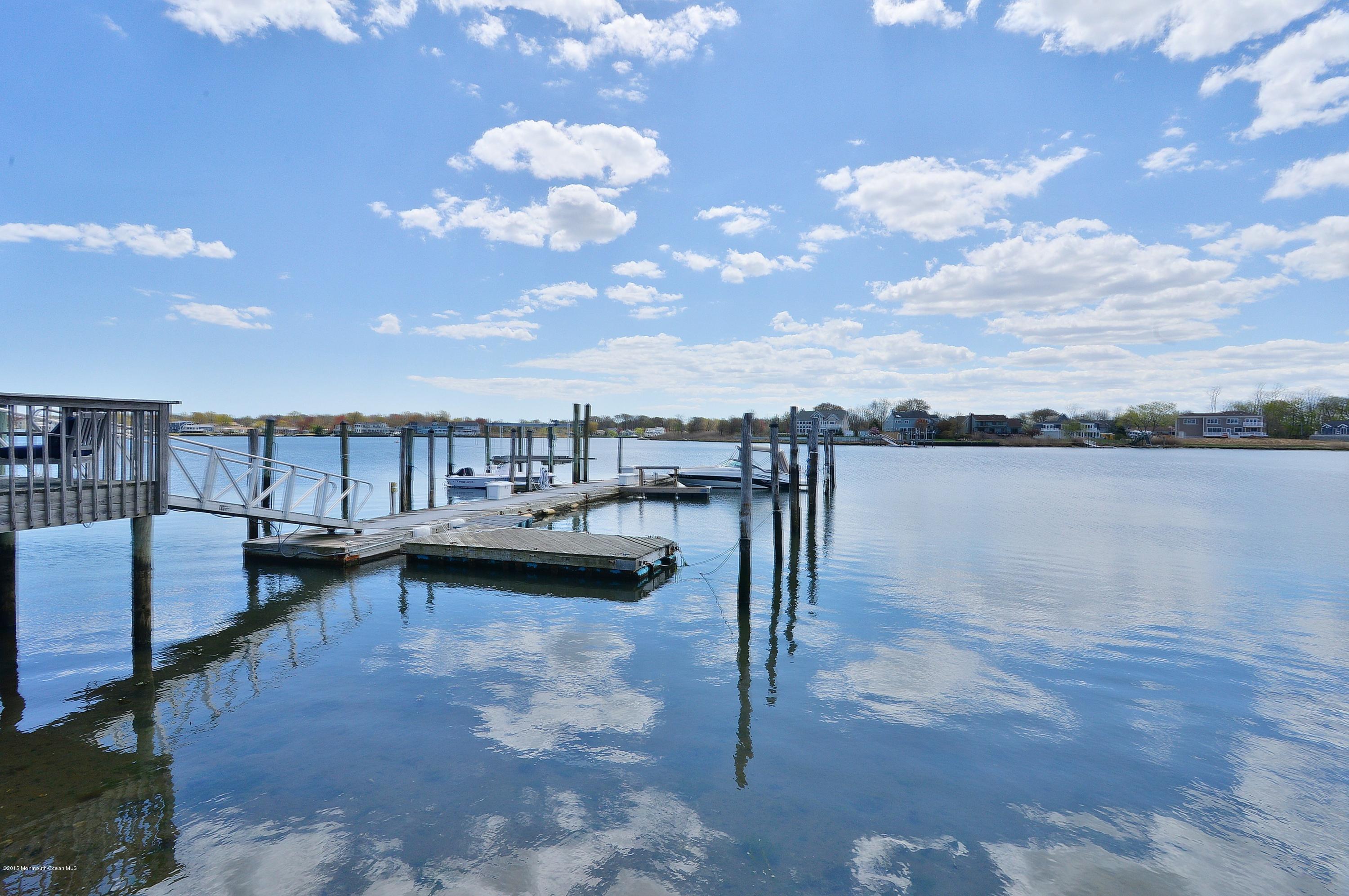 38 Silverside Avenue Little Silver, NJ 07739 - Photo 36 of 36 a view of a lake with couches in front of house