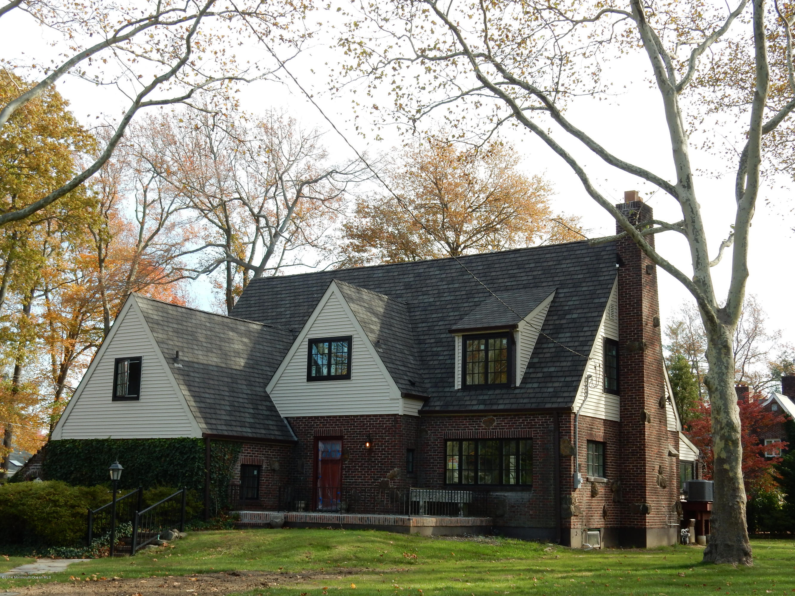 38 Silverside Avenue Little Silver, NJ 07739 - Photo 6 of 36 a front view of a house with a garden and trees