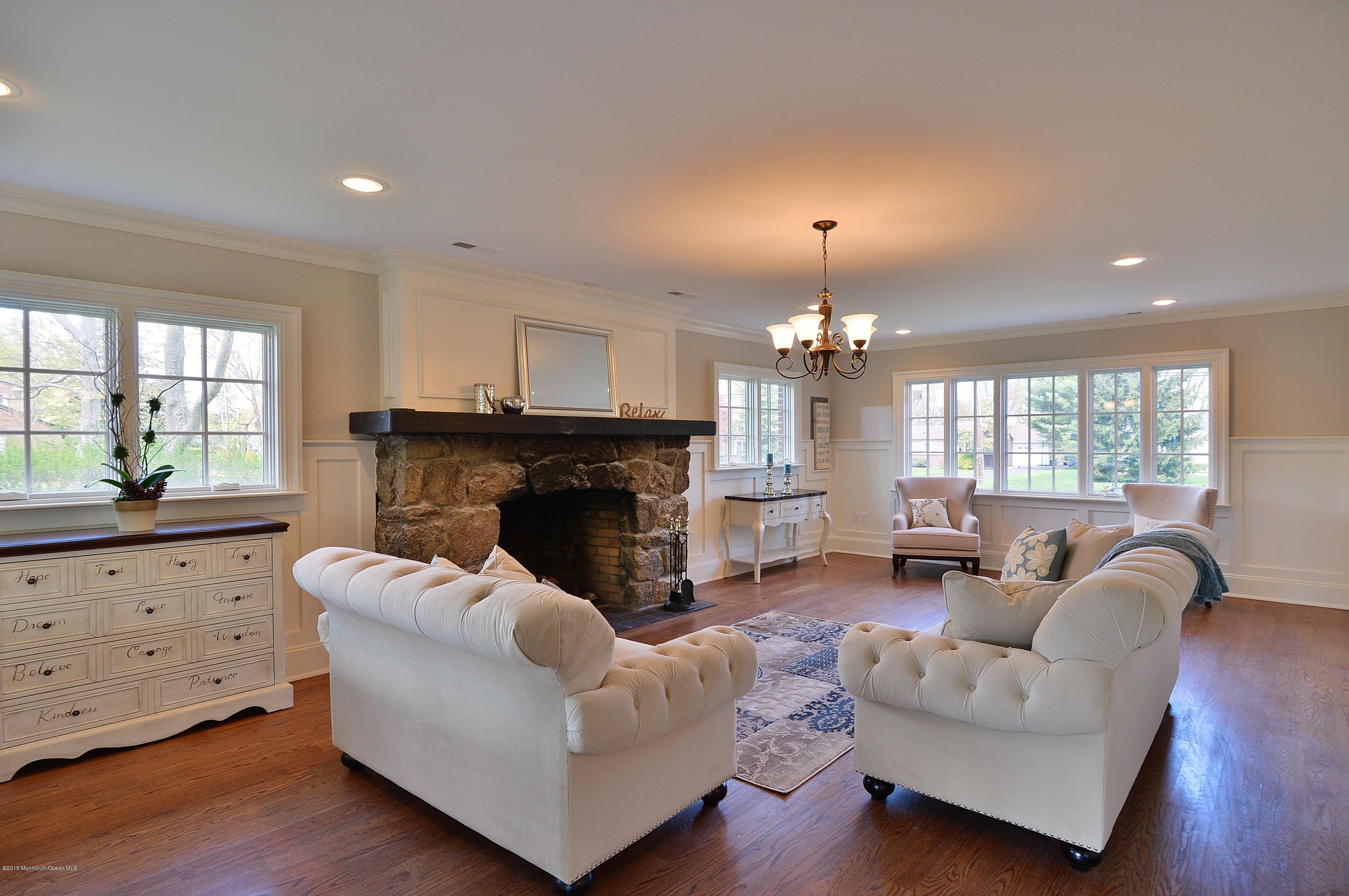 38 Silverside Avenue Little Silver, NJ 07739 - Photo 10 of 36 a living room with furniture fireplace and window
