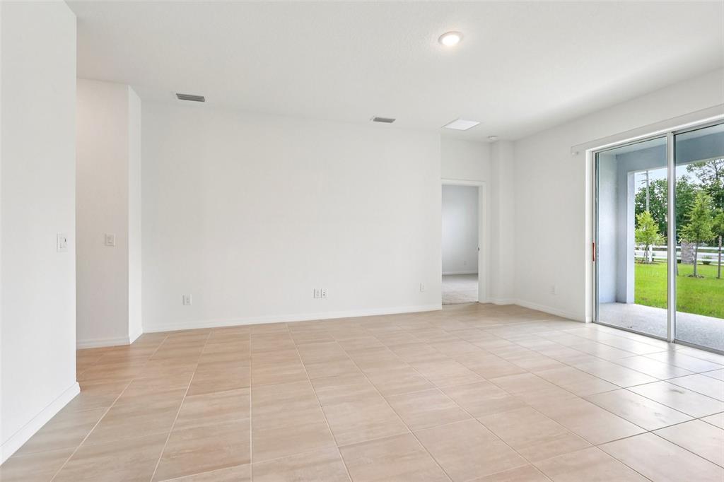 1756 Columbus Path St. Cloud, FL 34771 - Photo 13 of 37 a view of an empty room with a window
