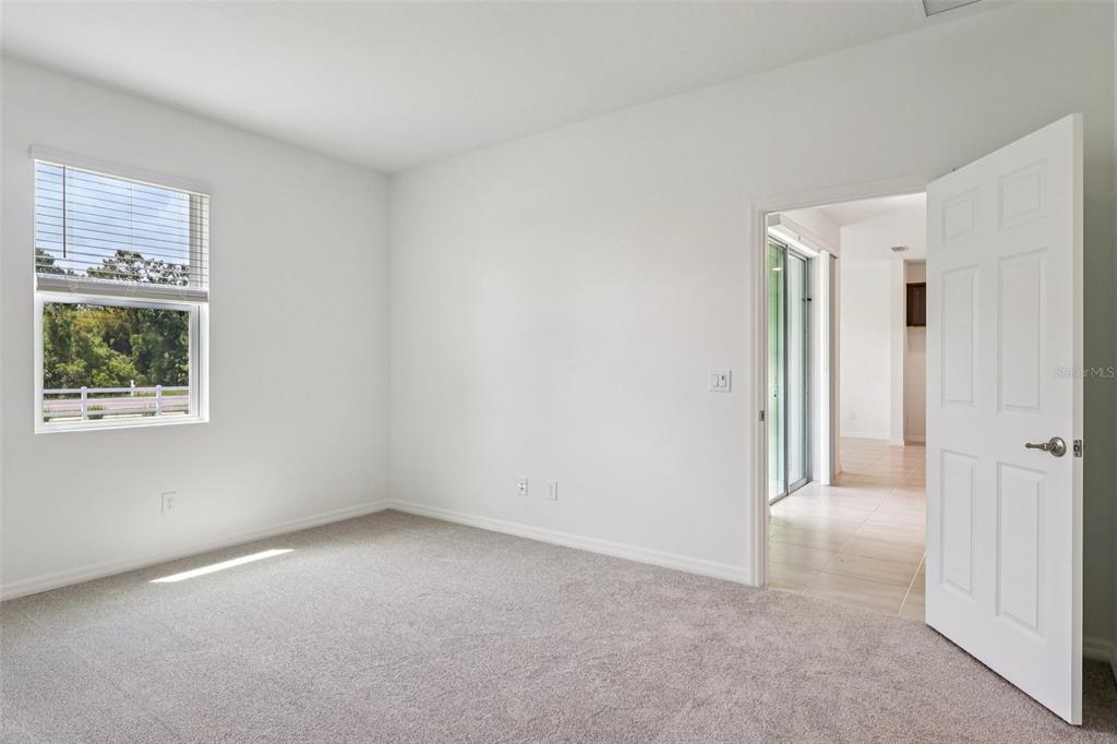 1756 Columbus Path St. Cloud, FL 34771 - Photo 20 of 37 a view of an empty room with a window