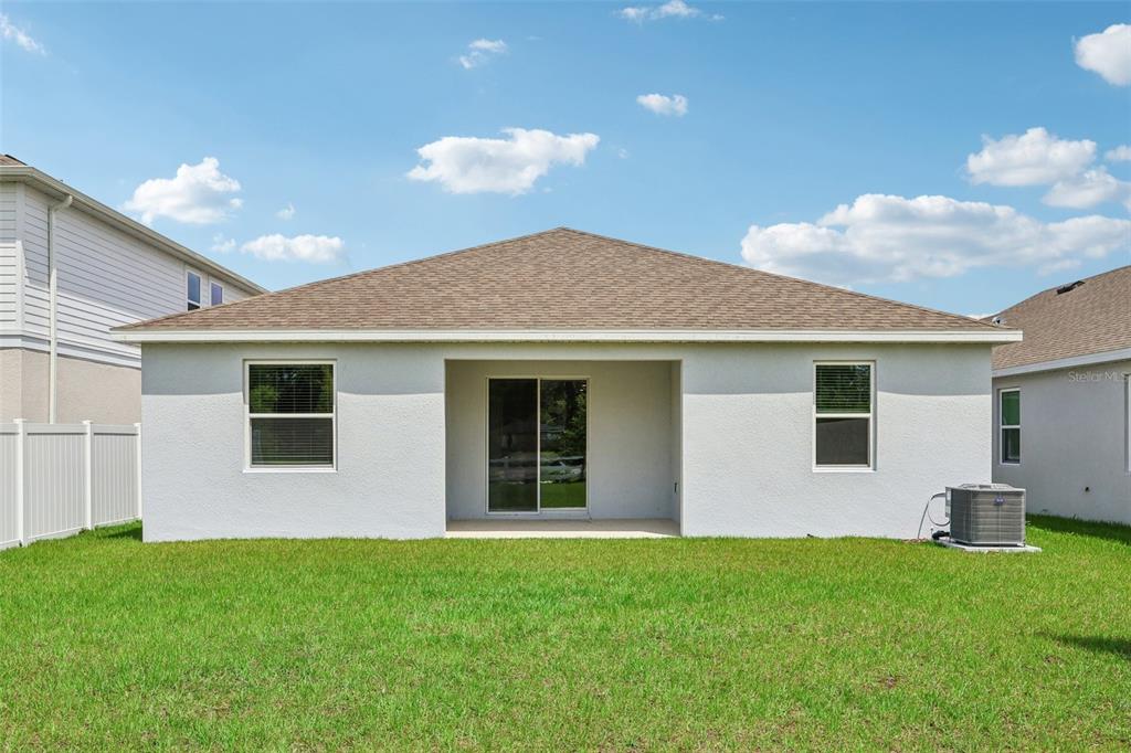 1756 Columbus Path St. Cloud, FL 34771 - Photo 28 of 37 a view of a house with backyard