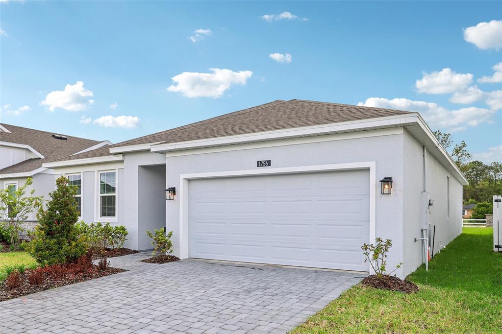1756 Columbus Path St. Cloud, FL 34771 - Photo 3 of 37 a front view of house with yard