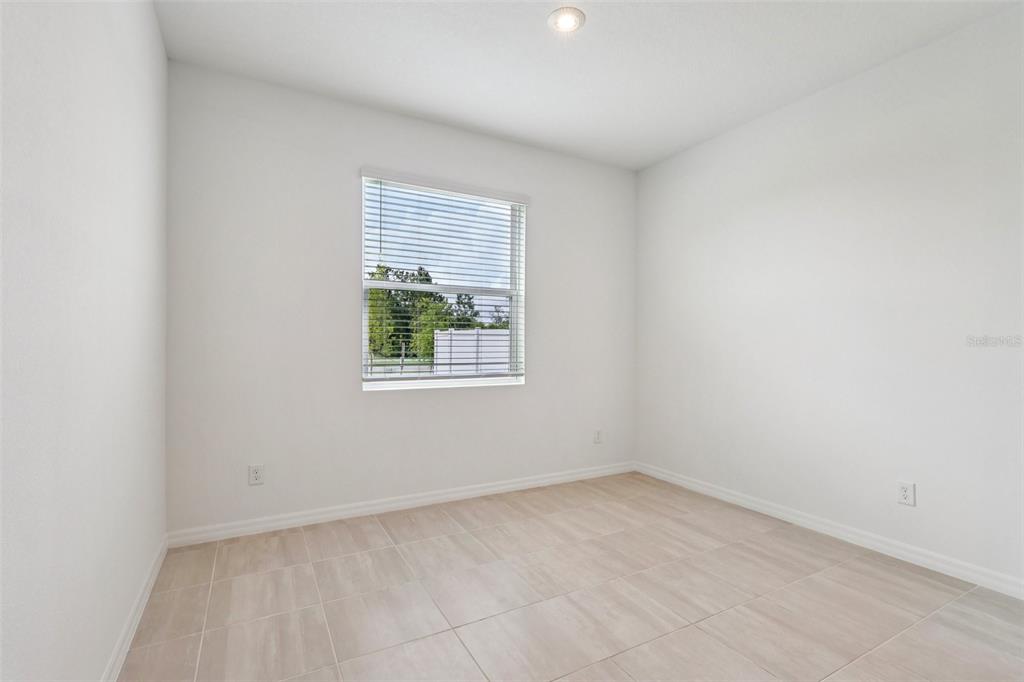 1756 Columbus Path St. Cloud, FL 34771 - Photo 8 of 37 an empty room with a window