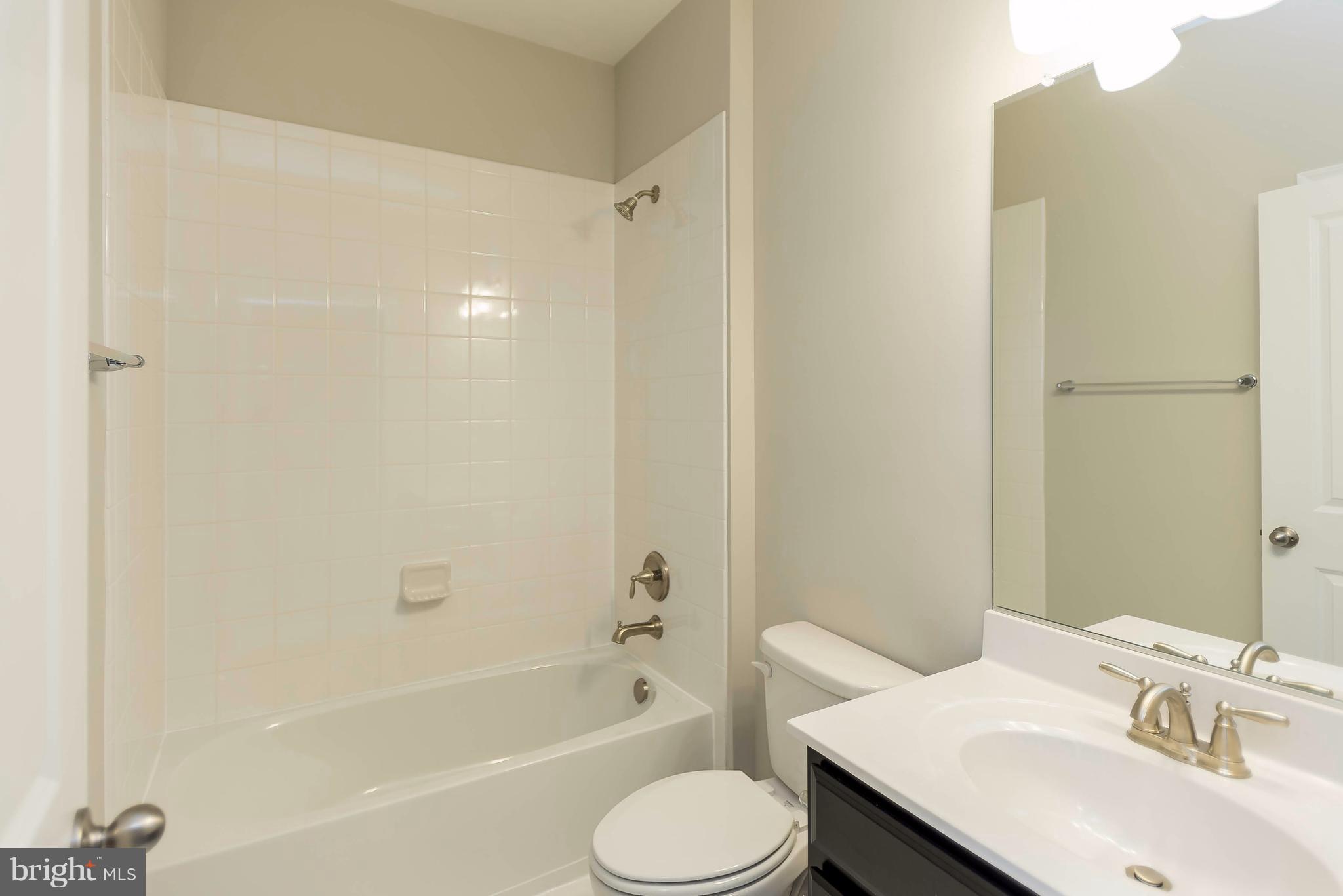 4609 Cambria Road Frederick, MD 21703 - Photo 22 of 29 a bathroom with a sink toilet and a bathtub