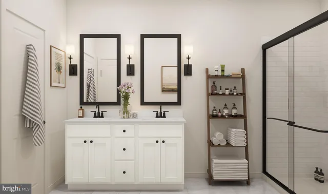 a bathroom with double vanity sink and two mirror