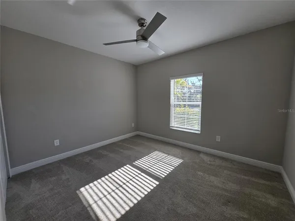 en empty room with windows