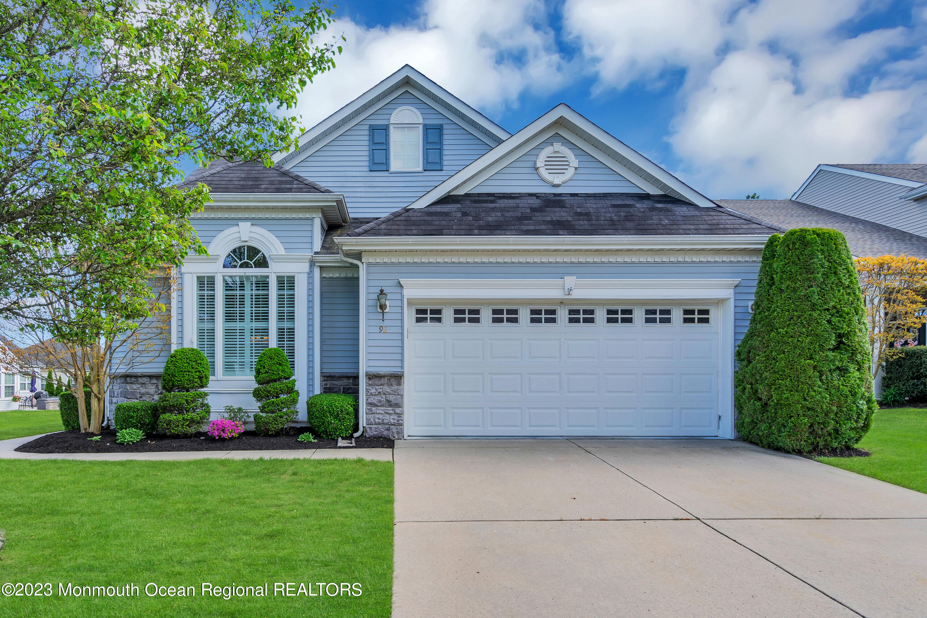 92 Pancoast Road Waretown, NJ 08758 - Photo 1 of 50 a front view of a house with a garden and plants