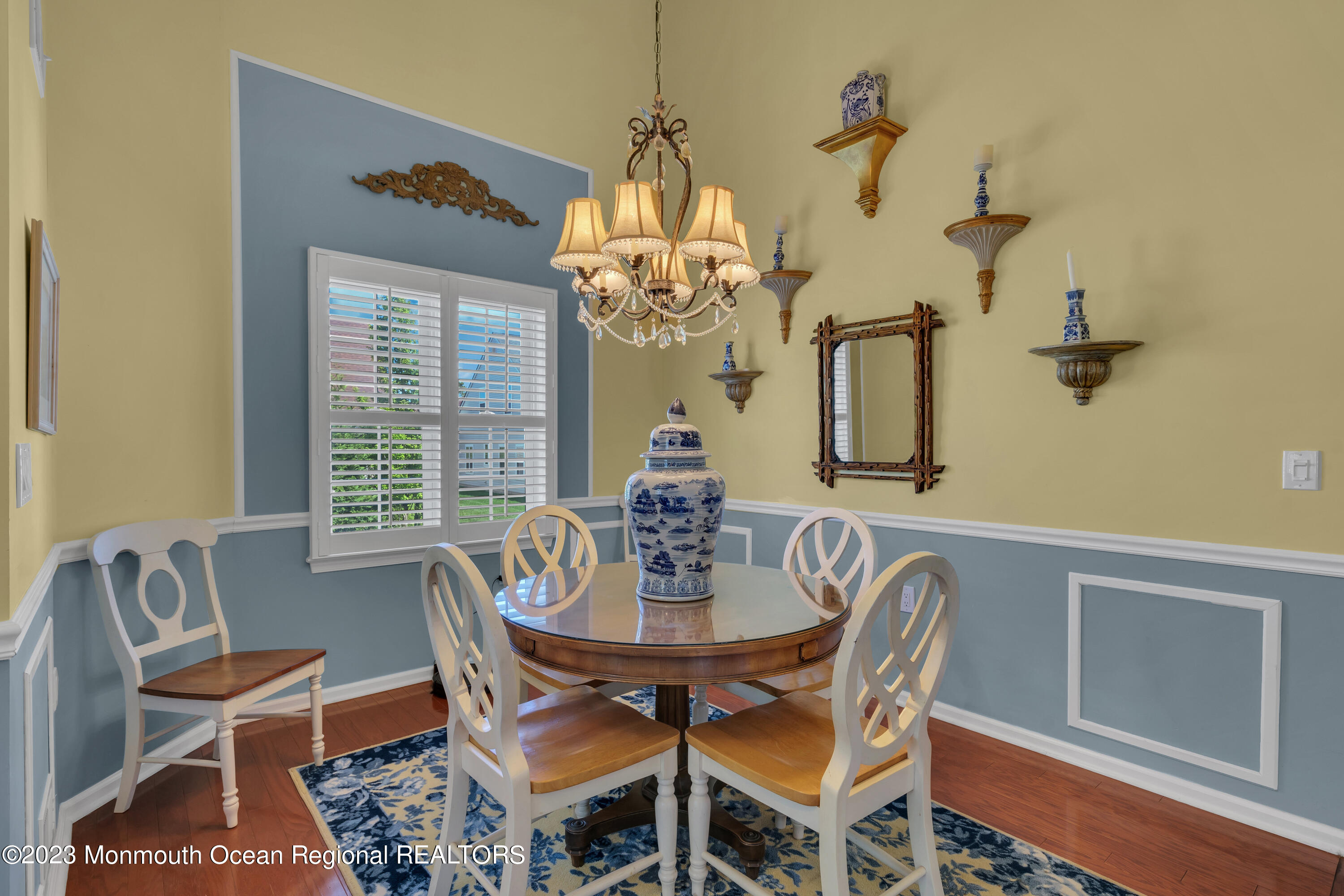 92 Pancoast Road Waretown, NJ 08758 - Photo 11 of 50 a dining room with furniture a chandelier and wooden floor