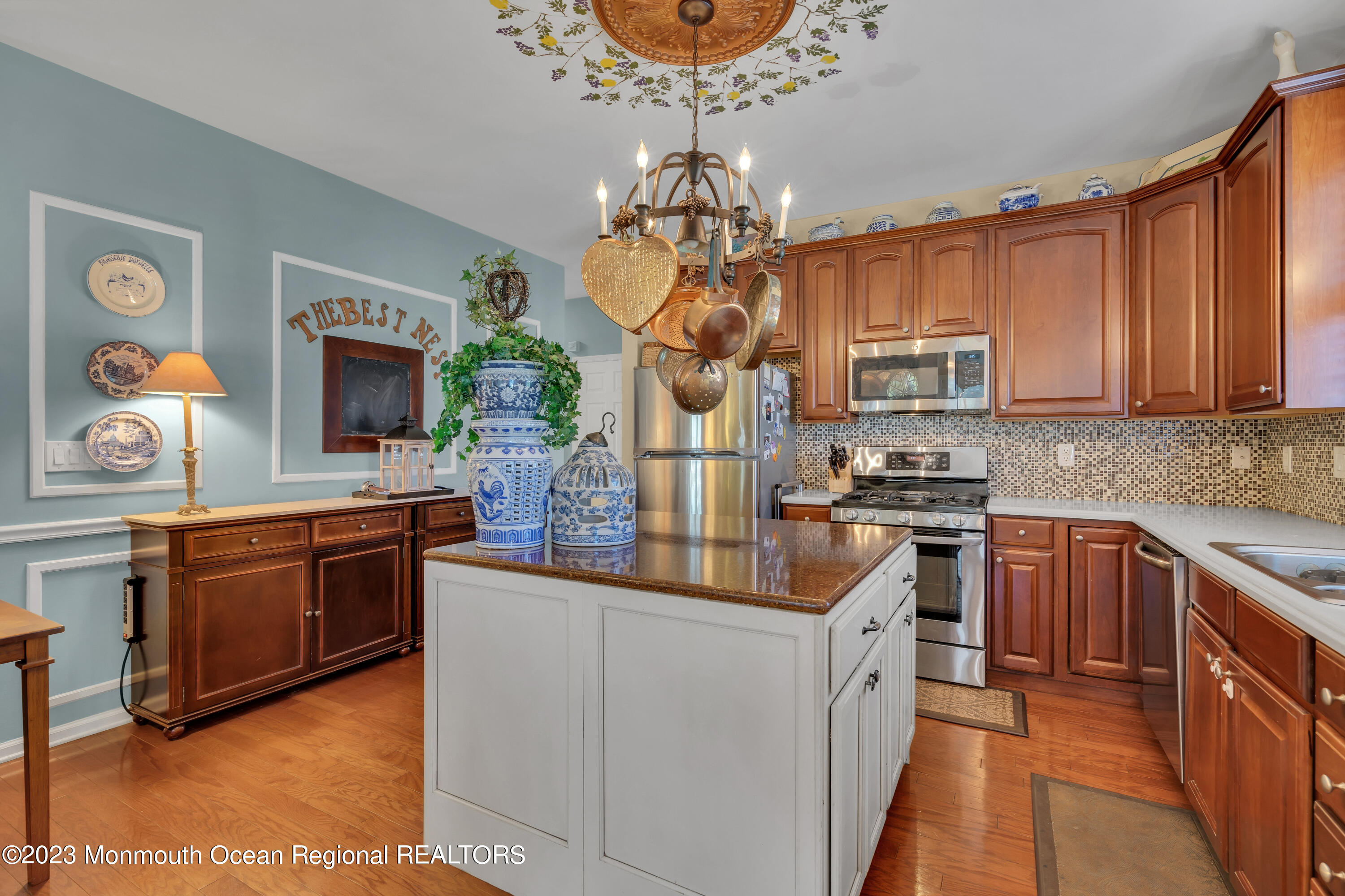 92 Pancoast Road Waretown, NJ 08758 - Photo 13 of 50 a kitchen with granite countertop a stove top oven a sink dishwasher and a microwave oven with cabinets