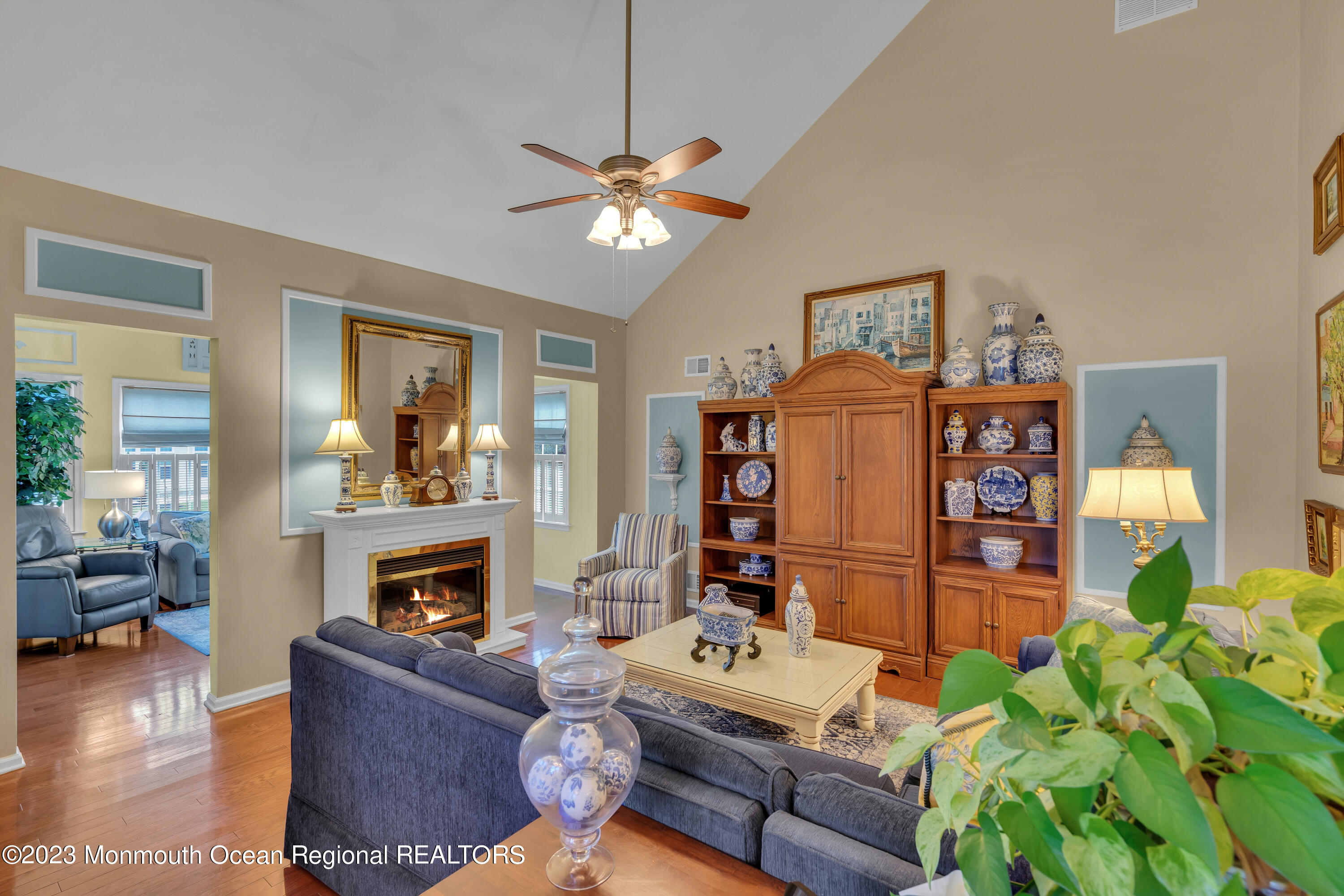 92 Pancoast Road Waretown, NJ 08758 - Photo 17 of 50 a living room with furniture a fireplace and a chandelier