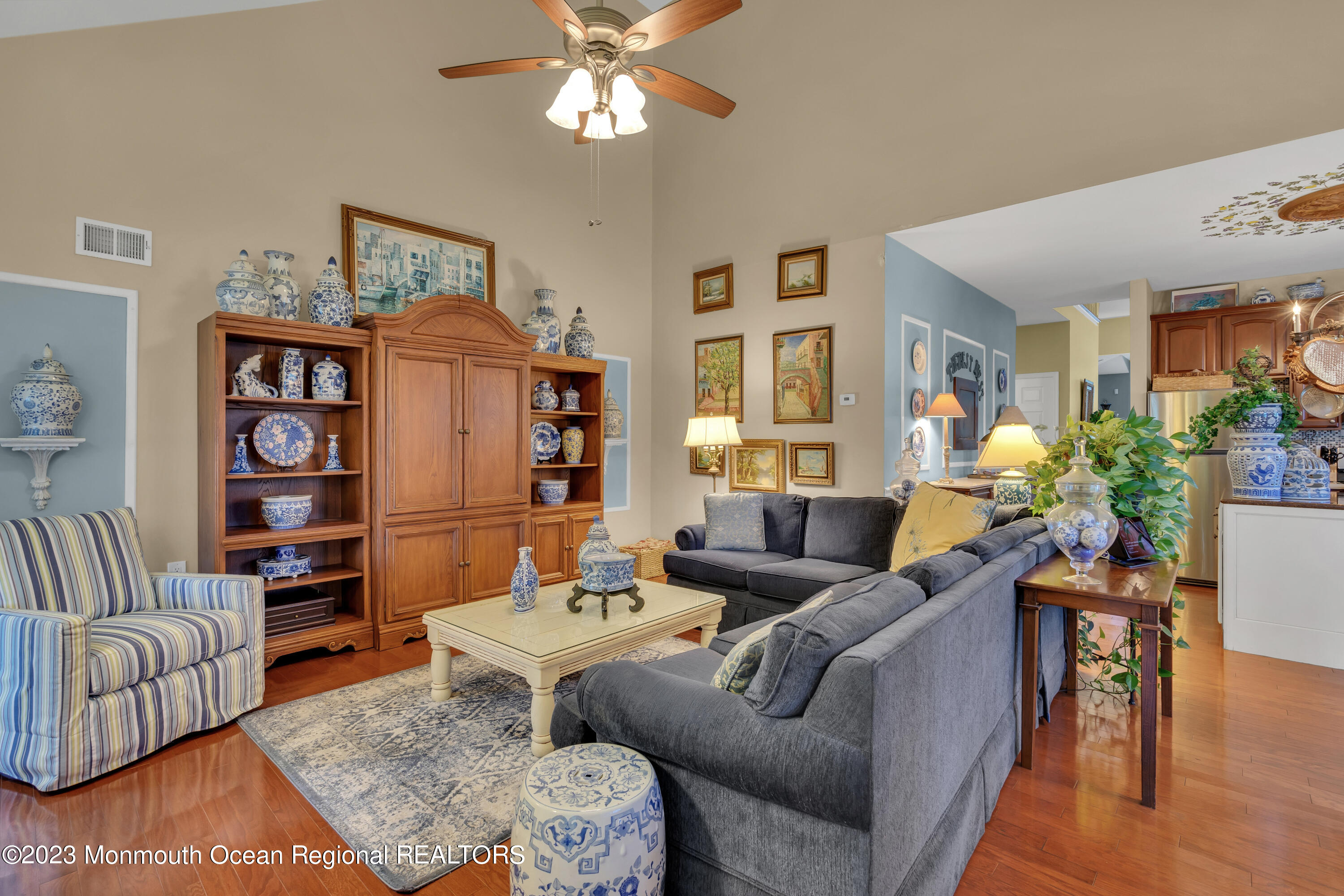 92 Pancoast Road Waretown, NJ 08758 - Photo 18 of 50 a living room with furniture a chandelier and a dining table