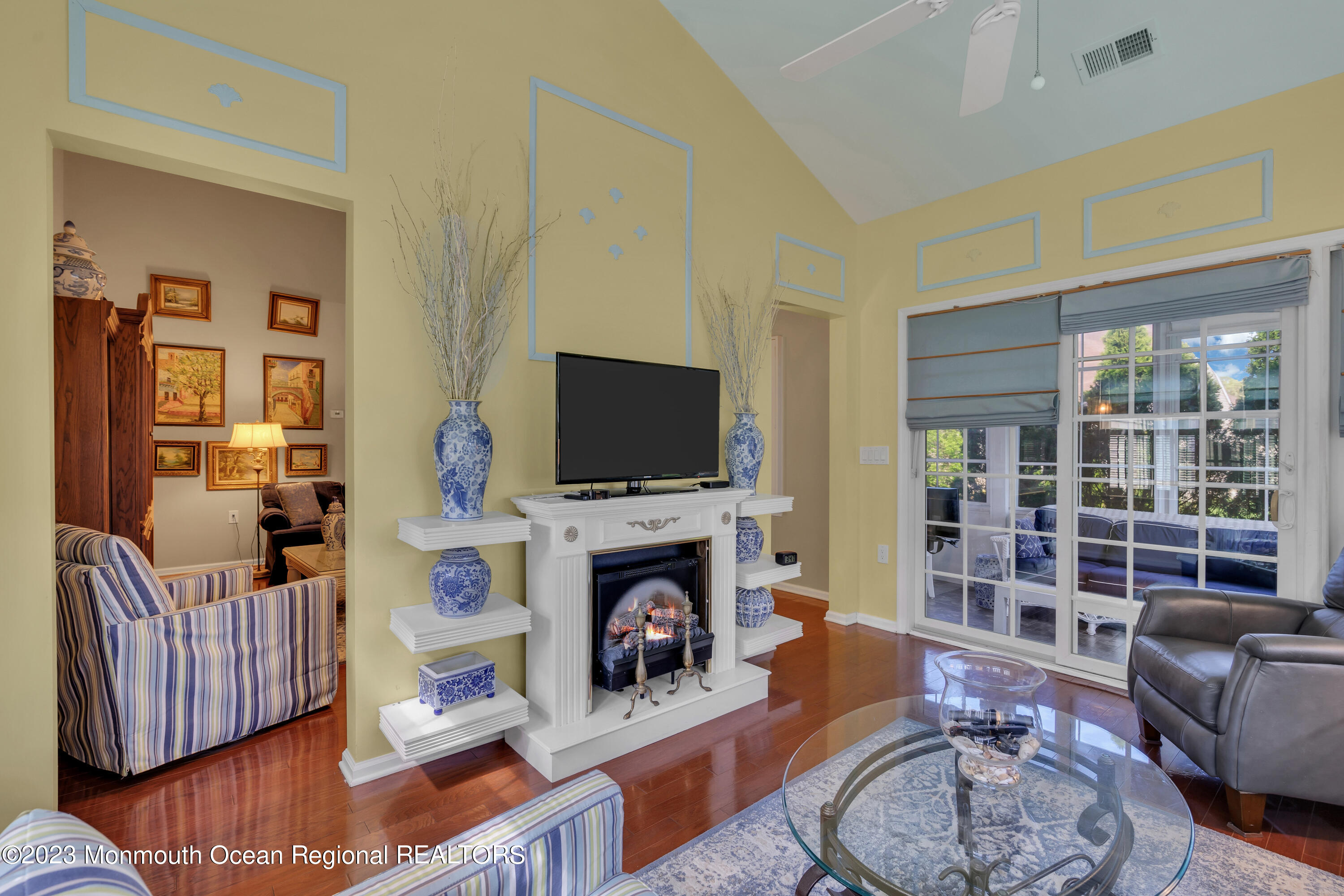 92 Pancoast Road Waretown, NJ 08758 - Photo 20 of 50 a living room with furniture fireplace and a flat screen tv