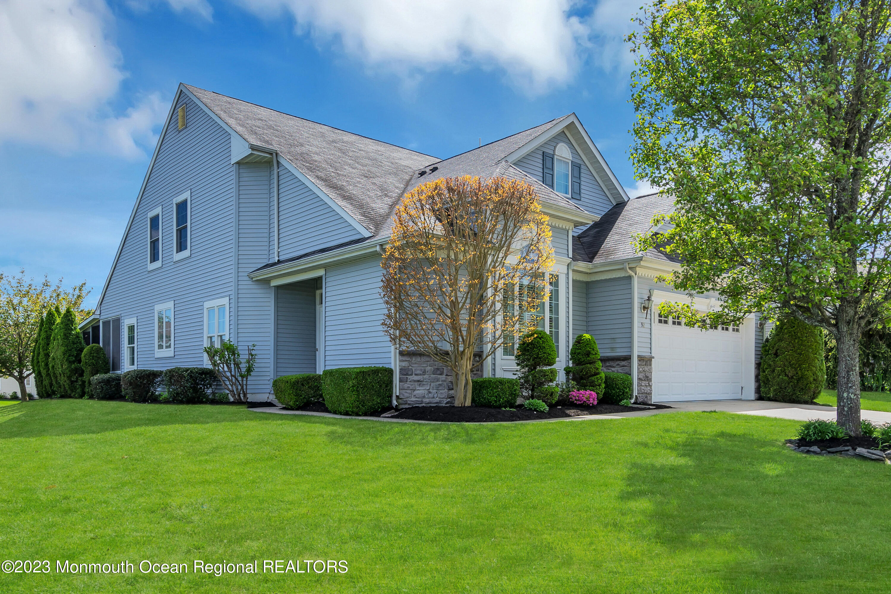 92 Pancoast Road Waretown, NJ 08758 - Photo 2 of 50 a front view of a house with a garden and yard