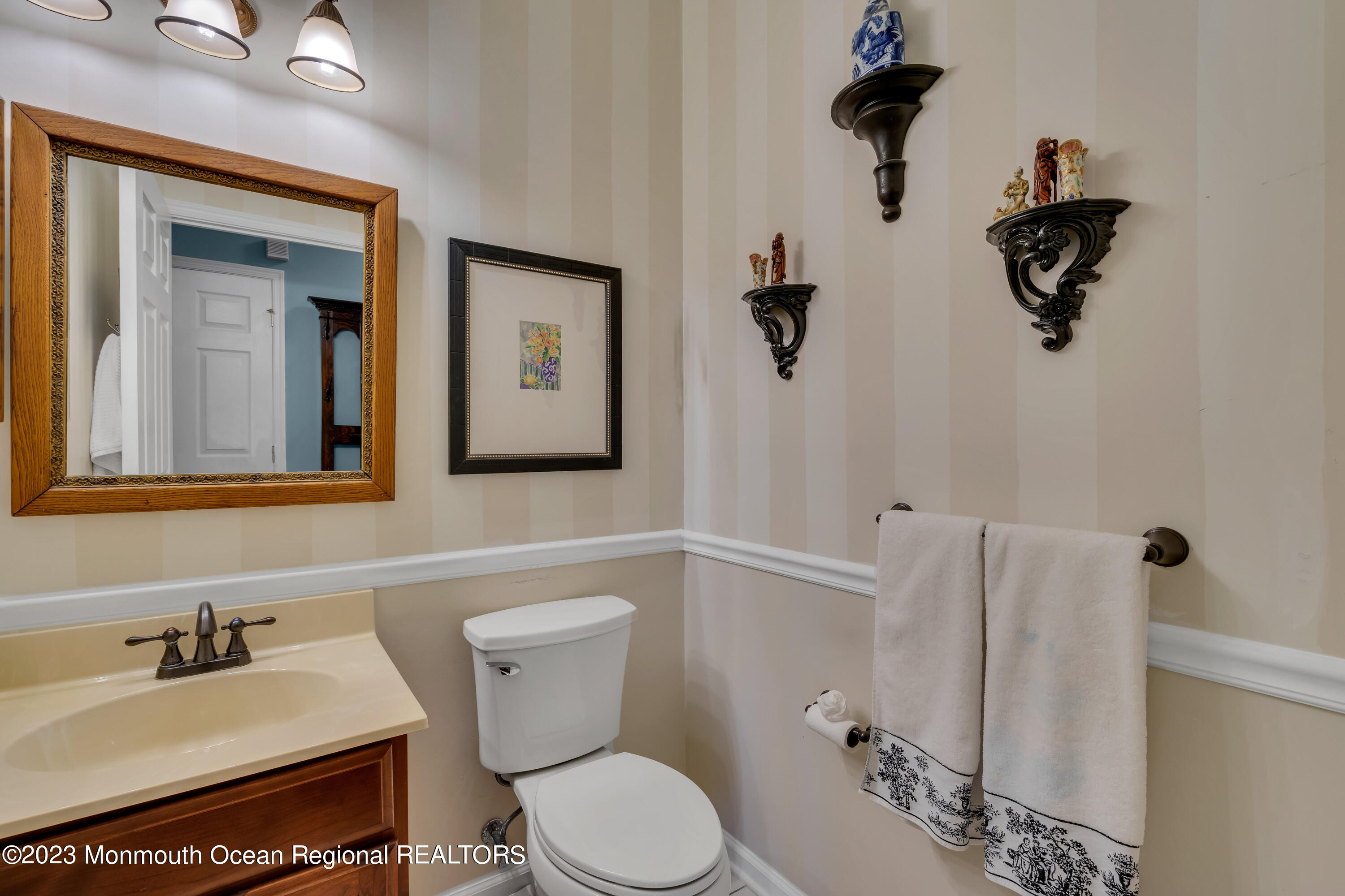 92 Pancoast Road Waretown, NJ 08758 - Photo 22 of 50 a bathroom with a toilet sink and mirror
