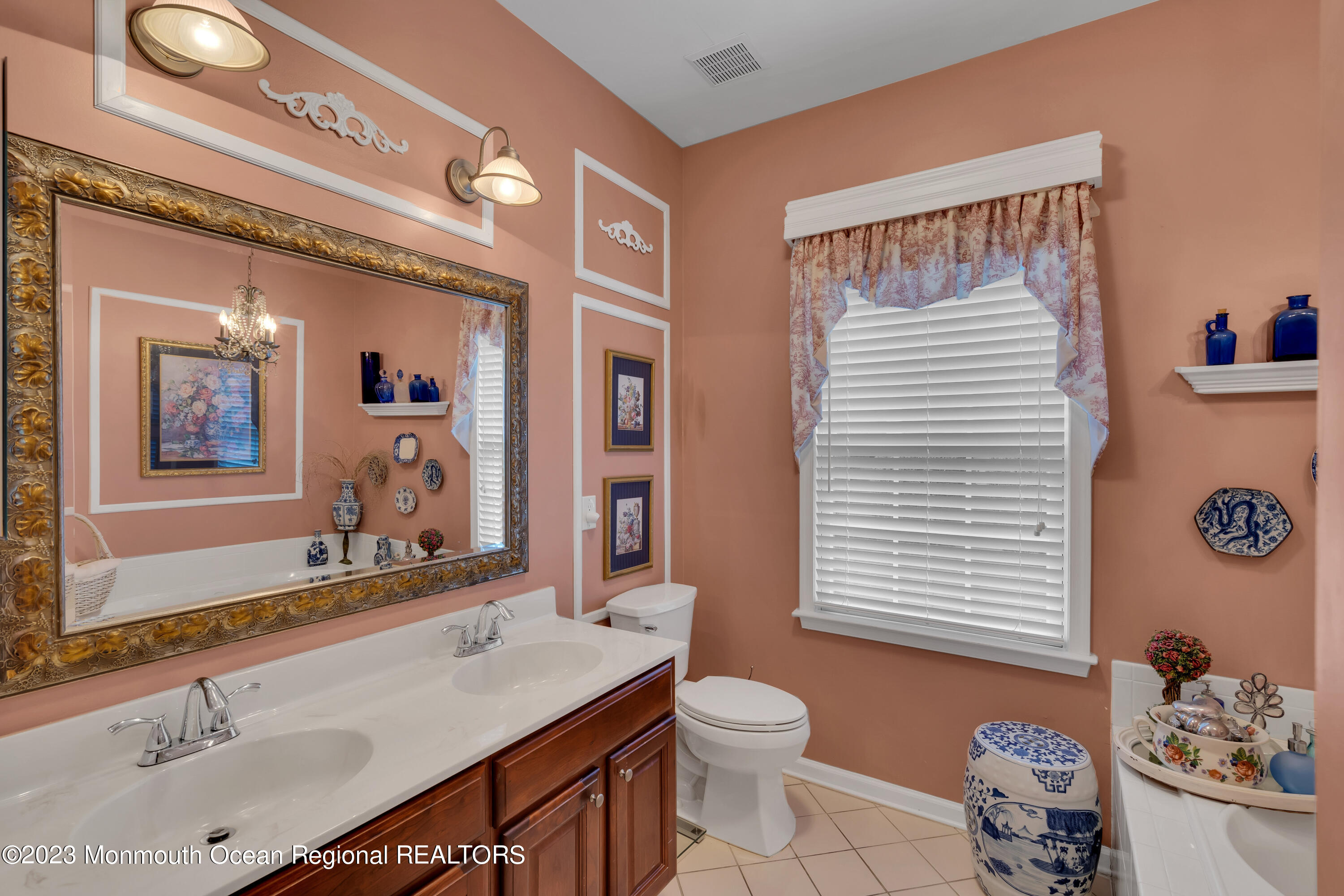92 Pancoast Road Waretown, NJ 08758 - Photo 28 of 50 a bathroom with a sink a toilet and mirror