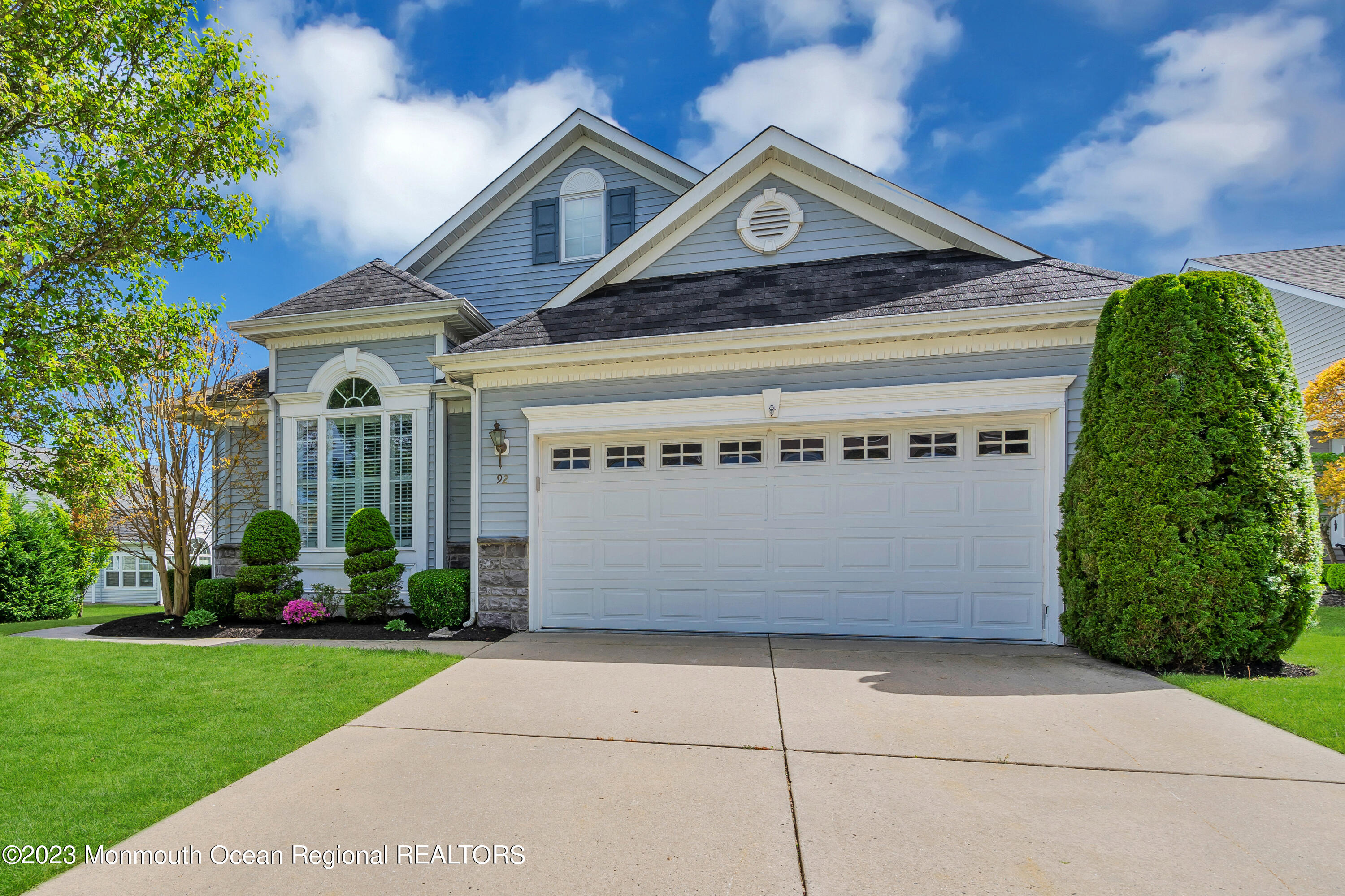92 Pancoast Road Waretown, NJ 08758 - Photo 3 of 50 a front view of a house with a garden