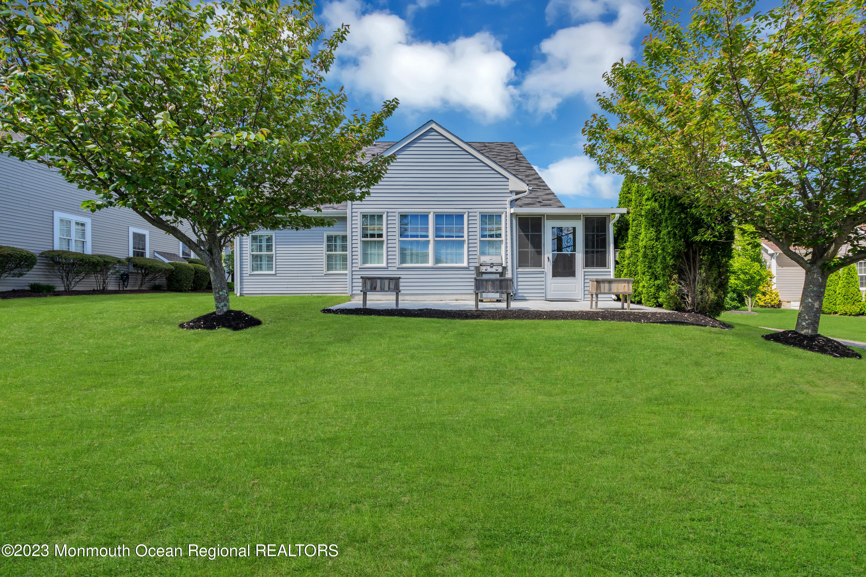 92 Pancoast Road Waretown, NJ 08758 - Photo 41 of 50 a front view of a house with a garden and trees