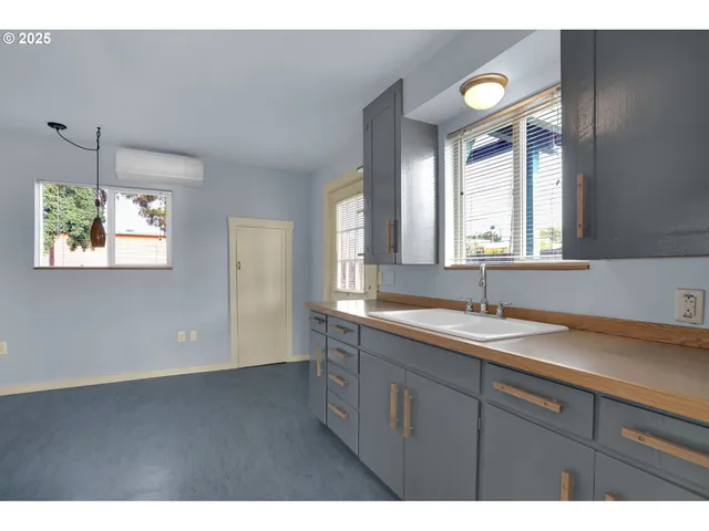 a bathroom with a sink and a window