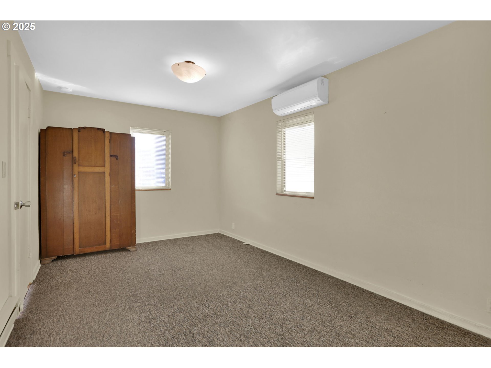 728 East Whiteaker Avenue Cottage Grove, OR 97424 - Photo 17 of 38 a view of an empty room with a window